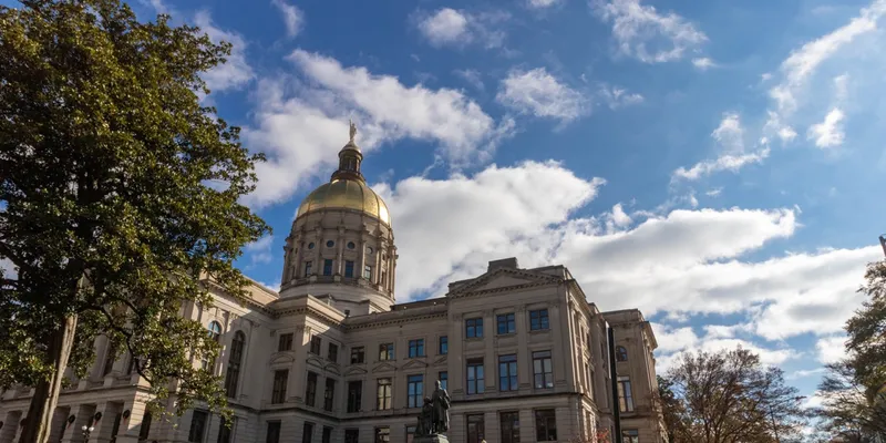 Georgia State Capitol building in Atlanta beneath a blue sky